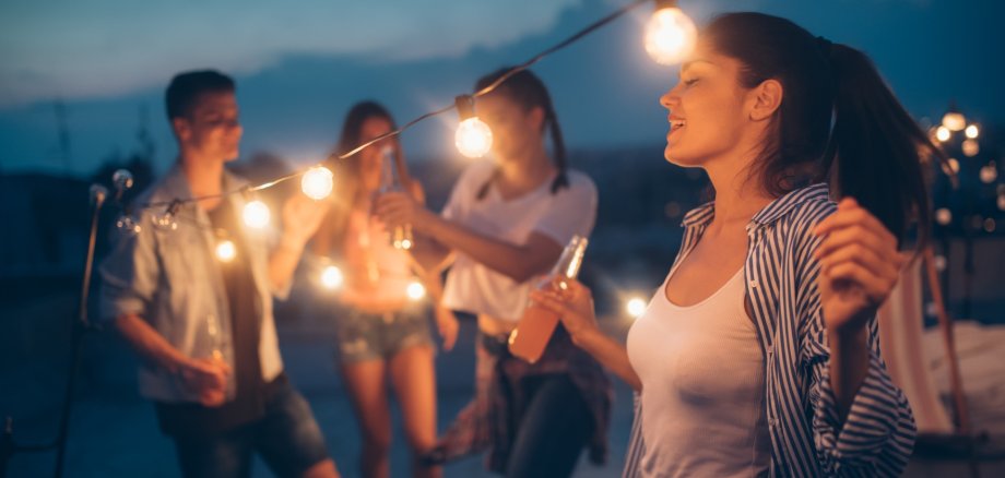 Group of happy young friends having party on rooftop Group of happy young friends having party on rooftop